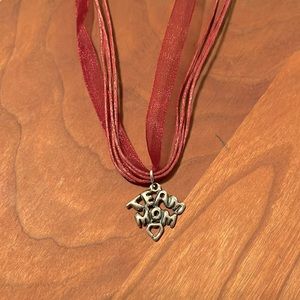 Sterling Silver Team Mom Charm on necklace.